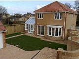 Serpentine walling and conservatory in Upwell